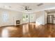 Open-concept living room featuring hardwood floors, fireplace, and lots of natural light at 1541 Pontiac Se Pl, Atlanta, GA 30315