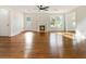Inviting living room with beautiful hardwood floors, fireplace, and front door access at 1541 Pontiac Se Pl, Atlanta, GA 30315