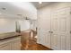 View of the open living room near kitchen and pantry with hardwood floors at 1541 Pontiac Se Pl, Atlanta, GA 30315