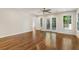 Spacious living room with hardwood floors, recessed lights, access to deck, and multiple windows at 1541 Pontiac Se Pl, Atlanta, GA 30315