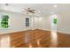 Spacious main bedroom with hardwood floors, ceiling fan, recessed lights, and ensuite access at 1541 Pontiac Se Pl, Atlanta, GA 30315