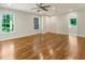 Spacious main bedroom with hardwood floors, ceiling fan, recessed lights, and ensuite access at 1541 Pontiac Se Pl, Atlanta, GA 30315