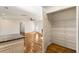 Pantry with wire shelving inside a utility closet; living room visible at 1541 Pontiac Se Pl, Atlanta, GA 30315