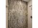 Walk-in shower featuring decorative tile at 1541 Pontiac Se Pl, Atlanta, GA 30315