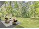 Spacious backyard features lush landscaping with a seating area, perfect for outdoor entertaining at 2905 Gresham Se Rd, Atlanta, GA 30316