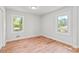 Bright bedroom featuring pristine white walls and hardwood flooring at 2905 Gresham Se Rd, Atlanta, GA 30316