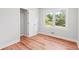 Bedroom with light grey walls, window and wood floors at 2905 Gresham Se Rd, Atlanta, GA 30316