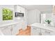 Bright kitchen features white cabinets, stainless steel appliances and light countertops at 2905 Gresham Se Rd, Atlanta, GA 30316