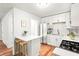 Bright kitchen features white cabinets, stainless steel appliances and island at 2905 Gresham Se Rd, Atlanta, GA 30316