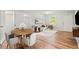 Bright living room with white walls, wood floors, and a view of the dining area and a comfy white sofa at 2905 Gresham Se Rd, Atlanta, GA 30316