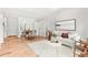 Bright living room with white walls, wood floors, and a view of the dining area and a comfy white sofa at 2905 Gresham Se Rd, Atlanta, GA 30316