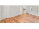 Cozy living room featuring white walls, wood floors, and views into a modern kitchen at 2905 Gresham Se Rd, Atlanta, GA 30316