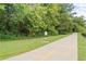 Concrete walking path with painted yellow line and surrounding greenery offers outdoor recreation at 2905 Gresham Se Rd, Atlanta, GA 30316