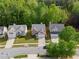 Aerial view of home showcasing mature trees, well-manicured lawn, and neighborhood at 4087 Rosebud Park Dr, Snellville, GA 30039