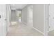 Upstairs hallway featuring a carpeted floor and multiple white doors at 4087 Rosebud Park Dr, Snellville, GA 30039