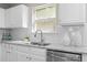 Kitchen featuring white cabinets, stainless steel appliances, and granite countertops at 4087 Rosebud Park Dr, Snellville, GA 30039