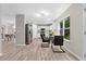 Open concept kitchen featuring stainless steel appliances and black breakfast nook seating at 4087 Rosebud Park Dr, Snellville, GA 30039