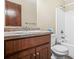 Bathroom featuring a wood vanity, countertop, a mirror, and a bathtub, providing a functional space at 4316 Acuba Sw Ct, Lilburn, GA 30047