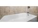 Clean white bathtub, part of a well-maintained bathroom, perfect for relaxation and comfort at 4316 Acuba Sw Ct, Lilburn, GA 30047