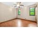 Large bedroom with wood floors, ceiling fan, and natural light from windows, providing a comfortable living space at 4316 Acuba Sw Ct, Lilburn, GA 30047
