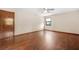 Spacious bedroom featuring beautiful hard wood floors and a ceiling fan with light at 4316 Acuba Sw Ct, Lilburn, GA 30047