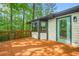 Spacious deck with railings and a view of the surrounding woods at 4316 Acuba Sw Ct, Lilburn, GA 30047