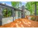Wooden deck with railing and a view of the surrounding green woods at 4316 Acuba Sw Ct, Lilburn, GA 30047