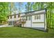 Charming home with a two-car garage, landscaped yard, and a delightful porch entrance at 4316 Acuba Sw Ct, Lilburn, GA 30047
