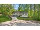 Charming home with a two-car garage, landscaped yard, and a delightful porch entrance at 4316 Acuba Sw Ct, Lilburn, GA 30047