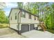 Charming home featuring a convenient two-car garage and inviting entryway staircase at 4316 Acuba Sw Ct, Lilburn, GA 30047