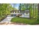Charming home with a two-car garage, landscaped yard, and a delightful porch entrance at 4316 Acuba Sw Ct, Lilburn, GA 30047