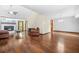 Open-concept living room featuring wood floors, fireplace, and lots of room to entertain at 4316 Acuba Sw Ct, Lilburn, GA 30047