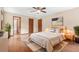 Spacious main bedroom with hardwood floors, a ceiling fan, and a neutral color palette creating a relaxing atmosphere at 4316 Acuba Sw Ct, Lilburn, GA 30047