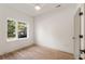 Sunlit bedroom showcasing hardwood floors and a large window overlooking the outdoor scenery at 1237 Memorial Se Dr # 406, Atlanta, GA 30316