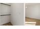 Bright bedroom with light hardwood flooring, ceiling fan, and walk-in closet at 1237 Memorial Se Dr # 406, Atlanta, GA 30316