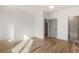Spacious bedroom with hardwood floors leading to bathroom at 1237 Memorial Se Dr # 406, Atlanta, GA 30316