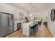 Kitchen featuring stainless steel appliances, an island with seating, and an open layout at 1237 Memorial Se Dr # 406, Atlanta, GA 30316