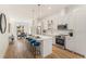 Bright open-concept kitchen with stainless steel appliances, island with seating, and hardwood floors at 1237 Memorial Se Dr # 406, Atlanta, GA 30316