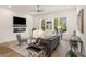 Bright living room featuring hardwood floors, a ceiling fan, and a cozy seating area at 1237 Memorial Se Dr # 406, Atlanta, GA 30316