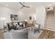 Cozy living room with a gray sofa, hardwood floors, and staircase at 1237 Memorial Se Dr # 406, Atlanta, GA 30316
