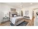 Inviting bedroom featuring a plush bed, soft lighting, and hardwood floors at 1237 Memorial Se Dr # 406, Atlanta, GA 30316
