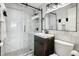 Modern bathroom with a glass-enclosed shower, sleek vanity, and stylish fixtures with black hardware at 215 Piedmont # 1804, Atlanta, GA 30308
