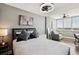 Modern bedroom featuring a comfortable bed, large windows, and a seating area at 215 Piedmont # 1804, Atlanta, GA 30308