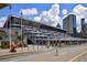 A convention center with glass windows and architectural steel elements with blue sky at 215 Piedmont # 1804, Atlanta, GA 30308