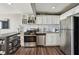 A well-equipped kitchen featuring stainless steel appliances, modern cabinets and countertop seating at 215 Piedmont # 1804, Atlanta, GA 30308