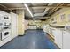 Clean laundry room with multiple machines, utility sink, and well-lit service area at 215 Piedmont # 1804, Atlanta, GA 30308