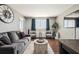 Stylish living room with comfortable seating, a large window, and elegant decor at 215 Piedmont # 1804, Atlanta, GA 30308