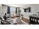Cozy living room featuring a plush sofa, natural light, and modern decor at 215 Piedmont # 1804, Atlanta, GA 30308