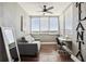 Bright sunroom with hardwood floors, large windows, ceiling fan and view at 215 Piedmont # 1804, Atlanta, GA 30308