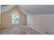 Small bedroom features neutral paint, carpeted floors, and a window with a light-filtering curtain at 2240 E Lake Ne Dr, Conyers, GA 30012
